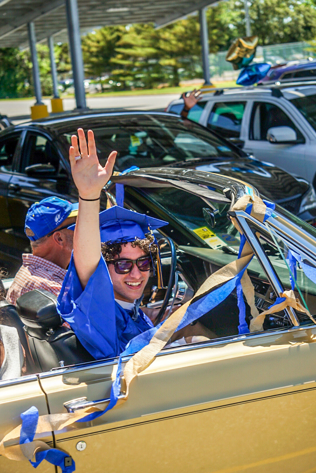 Holy Spirit drive-through diploma pickup
